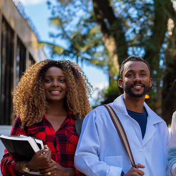 Allied health sciences students posing and smiling.