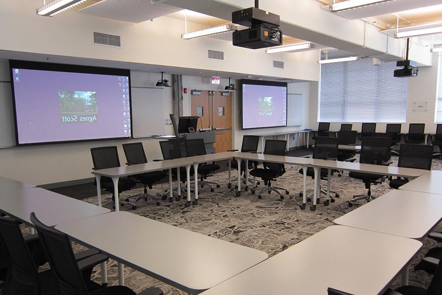 View of Campbell 115 seating arrangement and projection screens